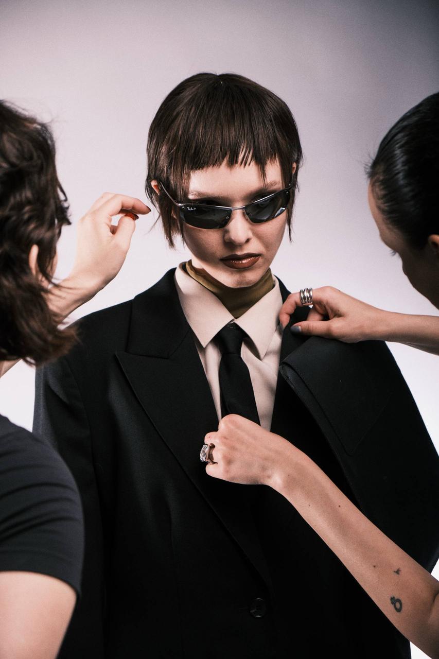 Editorial portrait in narrow angular sunglasses