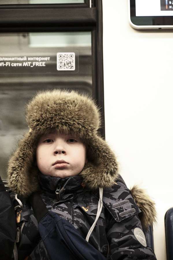 Portrait of a child in a fur hat
